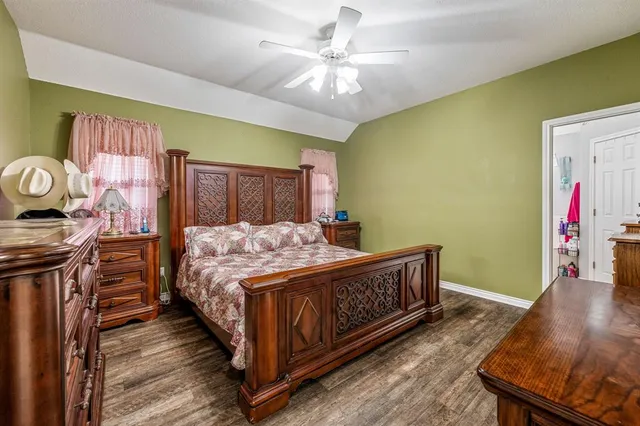 a bed room with a bed and a chandelier