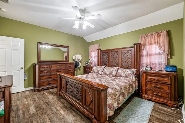 a bedroom with a bed and furniture
