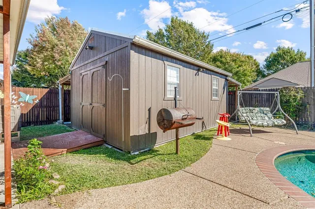 a view of a house with swimming pool and sitting area