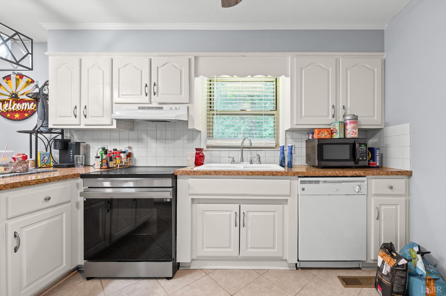 969 Hawkins Road Evington, VA 24550 - Photo 12 of 40 There are cabinets on the wall opposite this too. Convection oven 8 months old. DW 10 years old