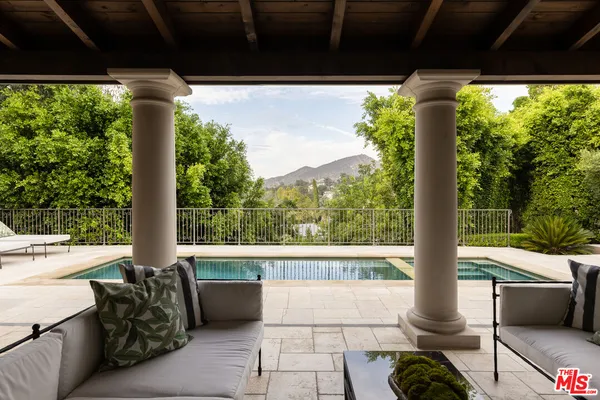 a view of balcony with furniture