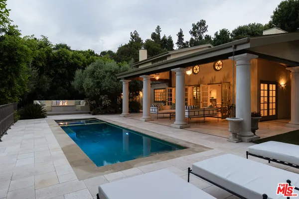 a view of a house with patio and sitting area