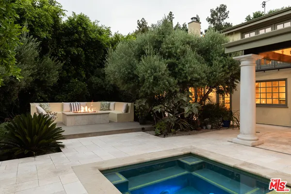 a view of swimming pool with chairs