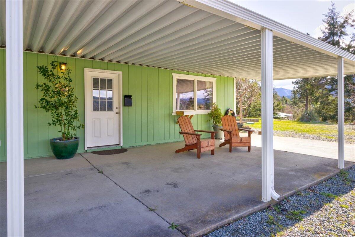 3651 Helms Road Grants Pass, OR 97527 - Photo 18 of 51 Covered patio or possible carport at the studio building.