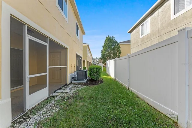 a view of backyard with potted plants