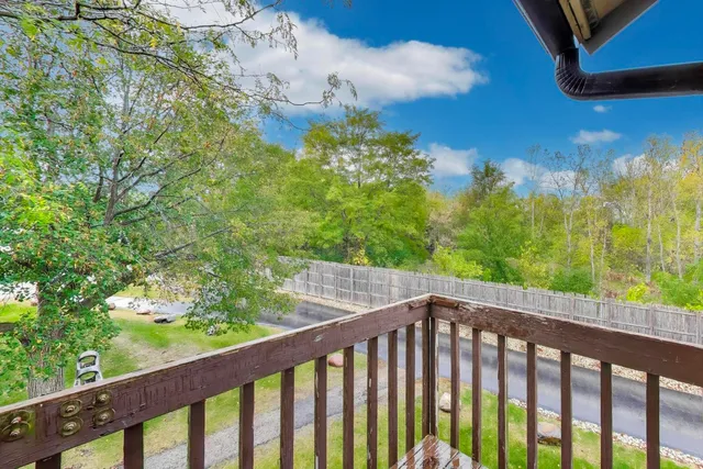 a view of a balcony with an outdoor space