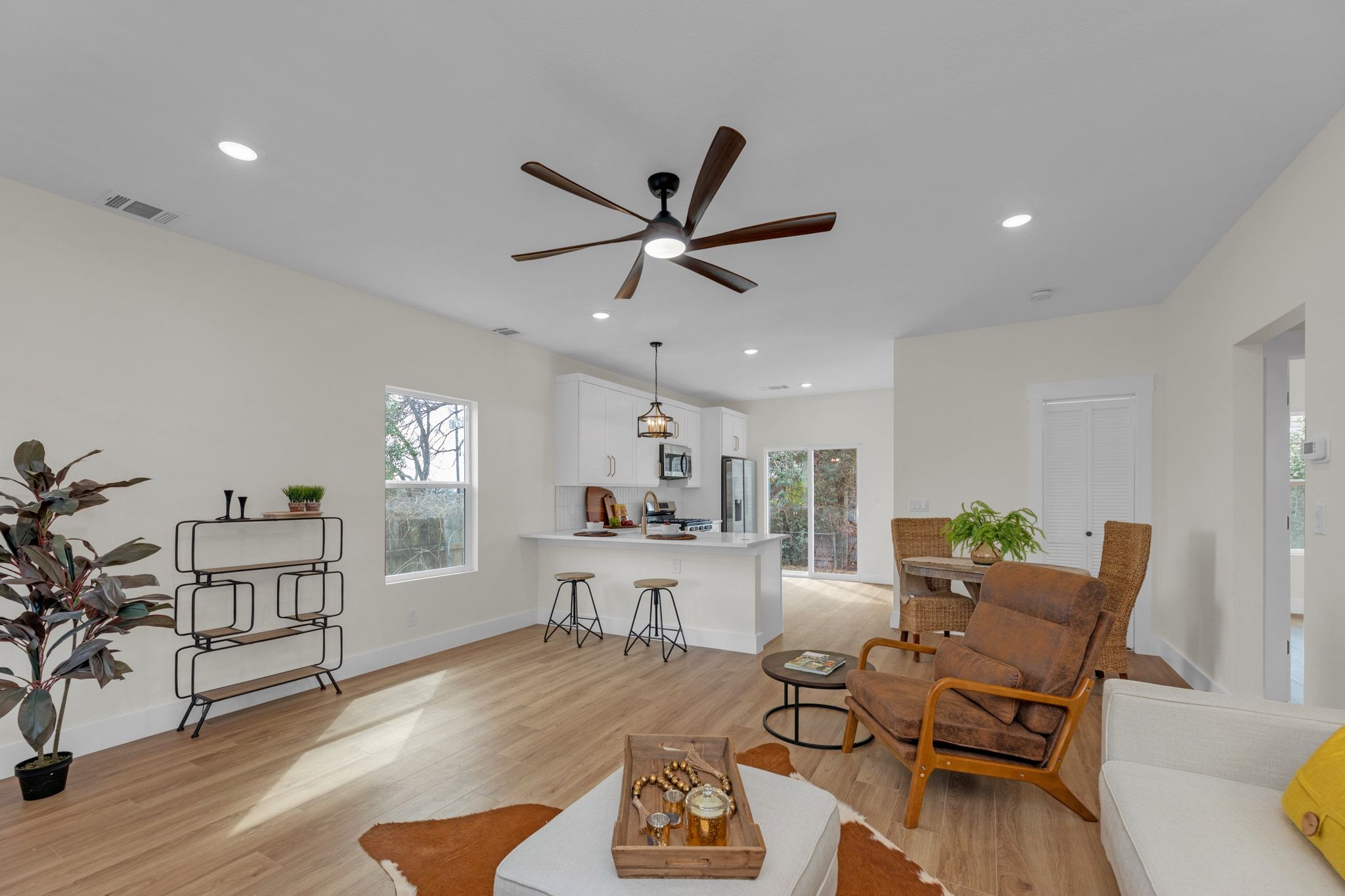 2102 South Church Street Georgetown, TX 78626 - Photo 32 of 40 Living room featuring light wood finished floors, ceiling fan, plenty of natural light, and recessed lighting
