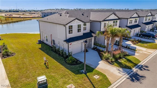 an aerial view of a house with swimming pool