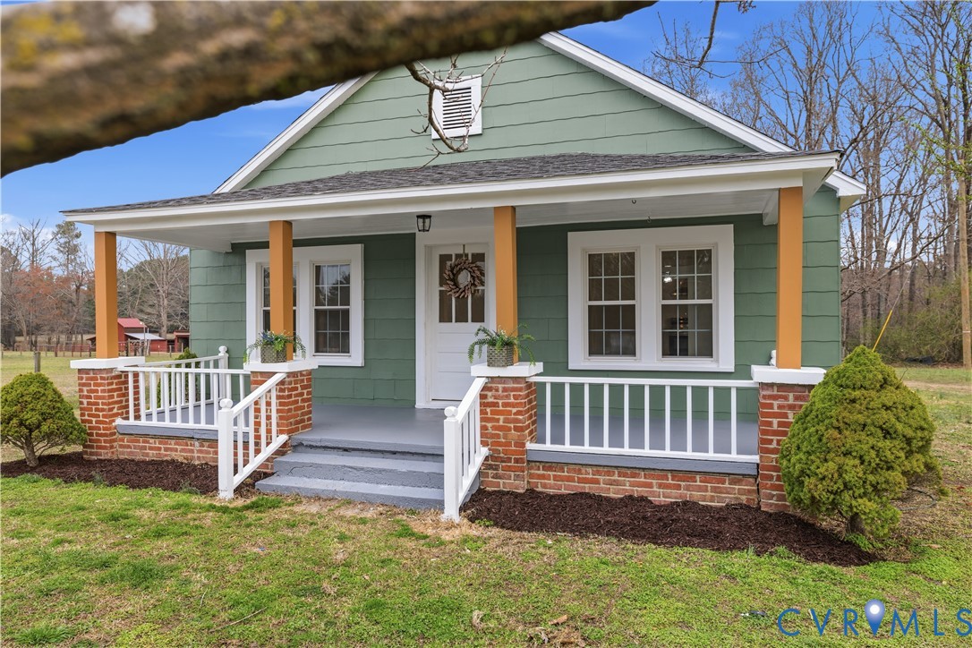 239 Brunswick Road Emporia, VA 23847 - Photo 23 of 24 Covered front porch with brick pillars, white rail