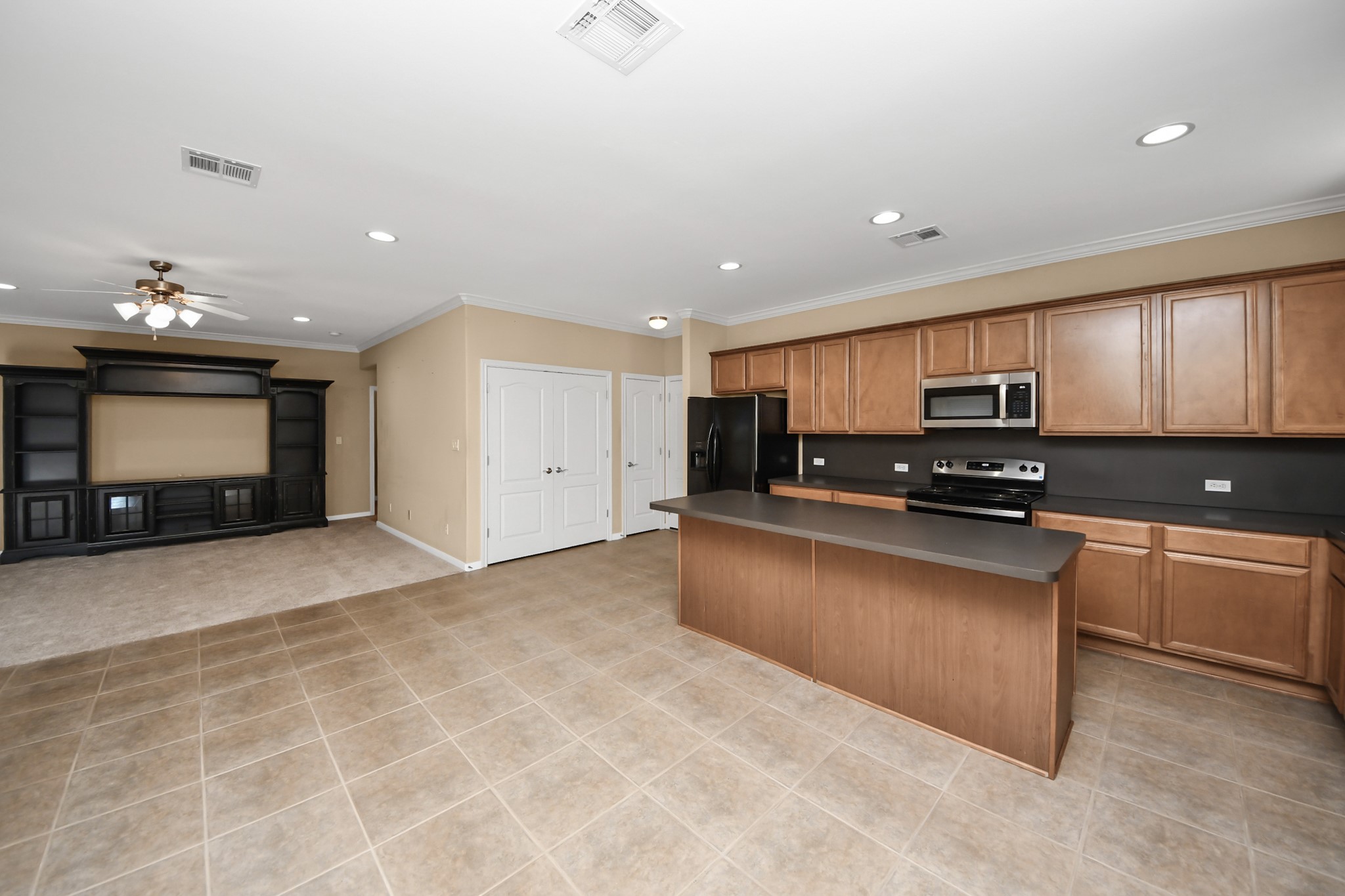 1733 Eagle Lake Road Sealy, TX 77474 - Photo 11 of 34 a kitchen with stainless steel appliances granite countertop a refrigerator and a stove top oven