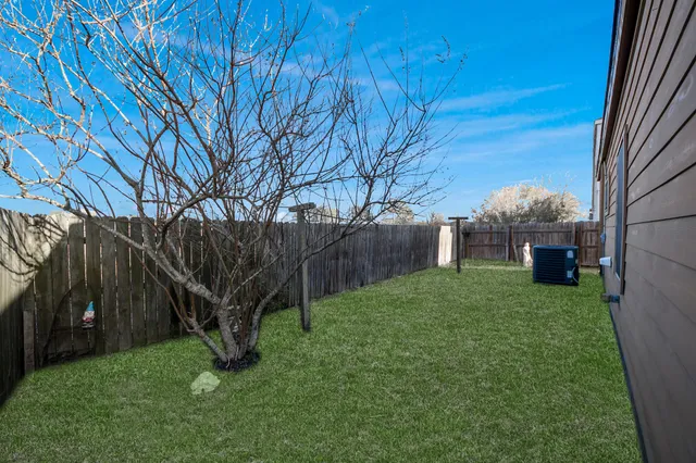 an aerial view of a house with a lake view