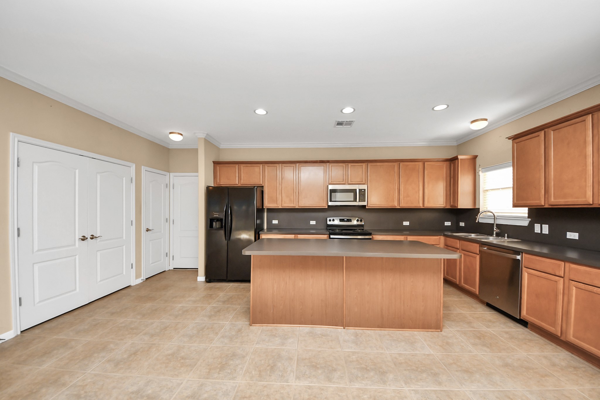 1733 Eagle Lake Road Sealy, TX 77474 - Photo 10 of 34 a kitchen with stainless steel appliances granite countertop a stove top oven a sink and dishwasher