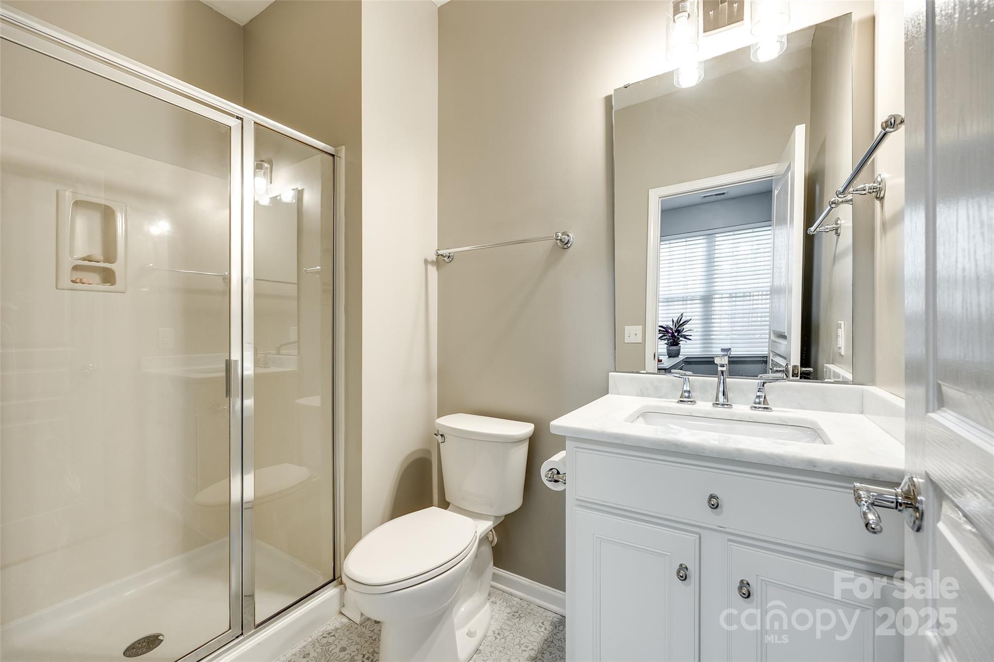 815 Granby Drive Fort Mill, SC 29708 - Photo 15 of 30 a bathroom with a sink toilet and shower