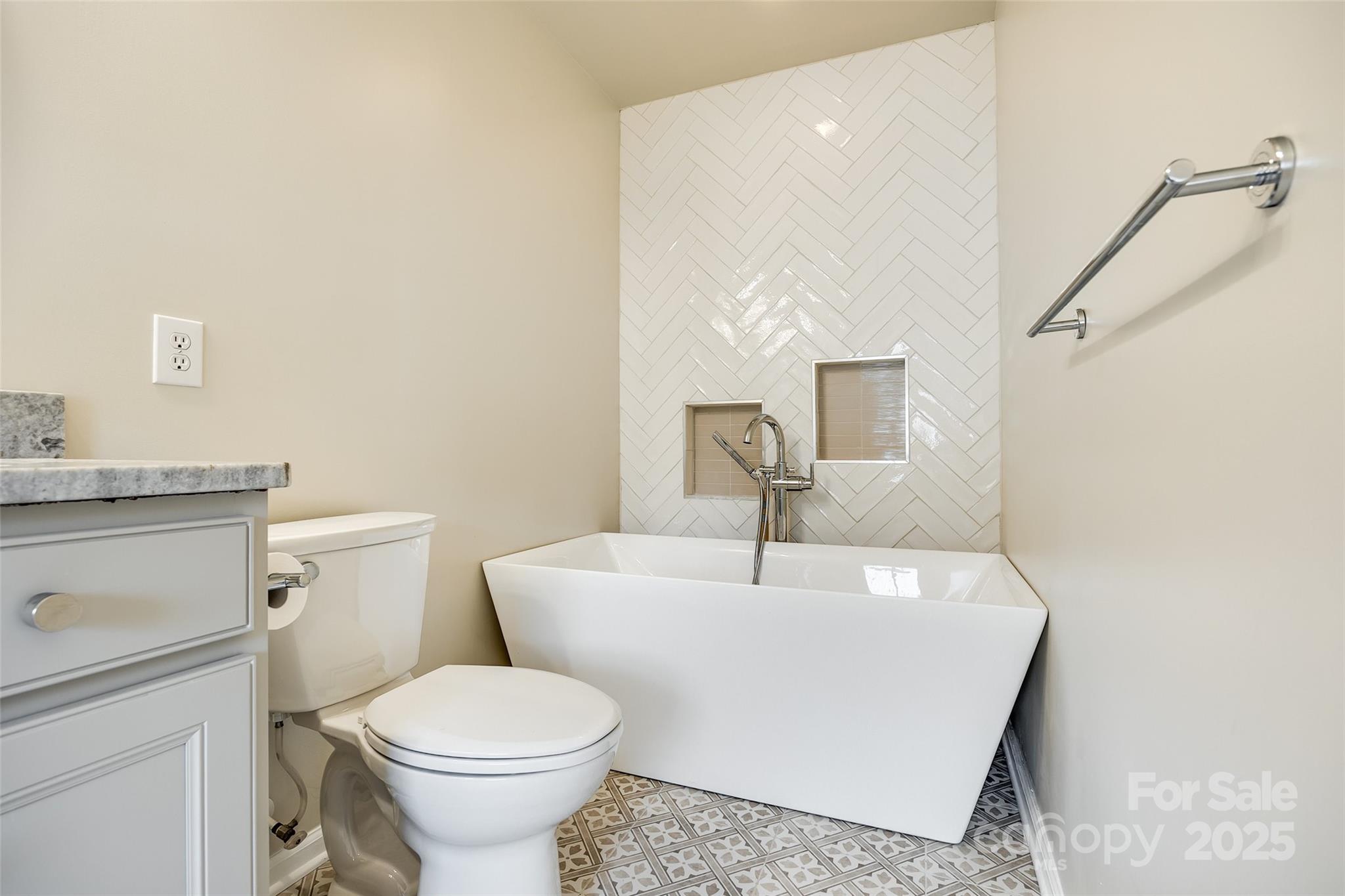 815 Granby Drive Fort Mill, SC 29708 - Photo 20 of 30 a white toilet sitting next to a bathroom sink