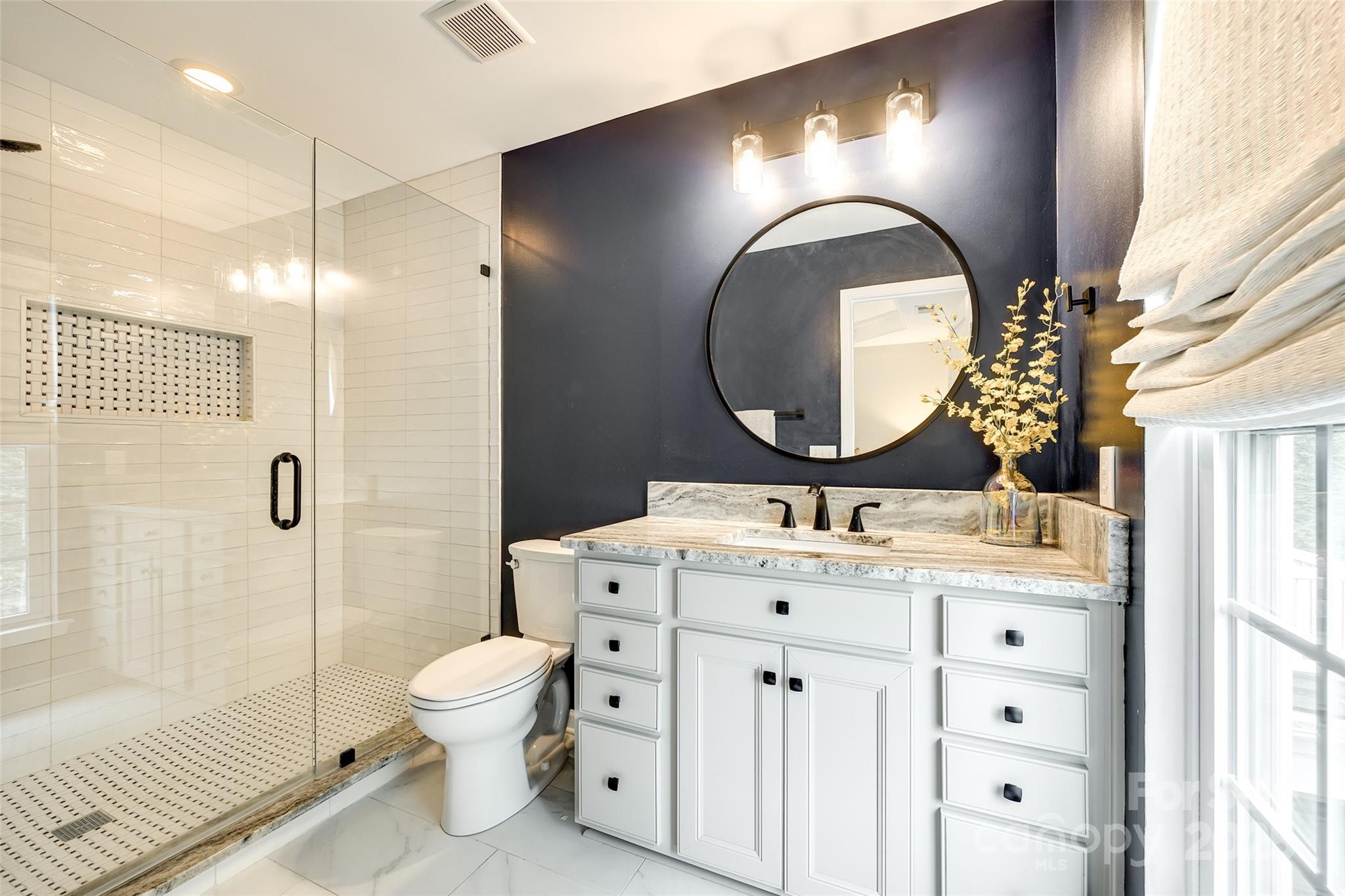 815 Granby Drive Fort Mill, SC 29708 - Photo 24 of 30 a bathroom with a sink mirror and toilet