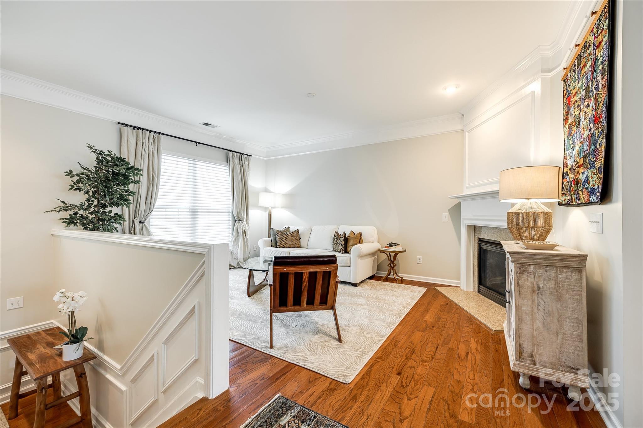 815 Granby Drive Fort Mill, SC 29708 - Photo 6 of 30 a living room with furniture a fireplace and a table