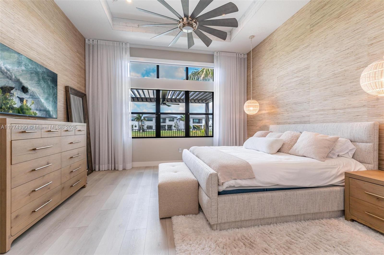 8577 Shoreacres Street Boca Raton, FL 33434 - Photo 23 of 67 a bedroom with a large bed and a window