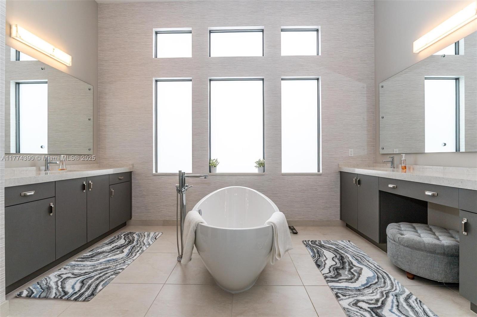 8577 Shoreacres Street Boca Raton, FL 33434 - Photo 25 of 67 a spacious bathroom with a double vanity sink bathtub and window