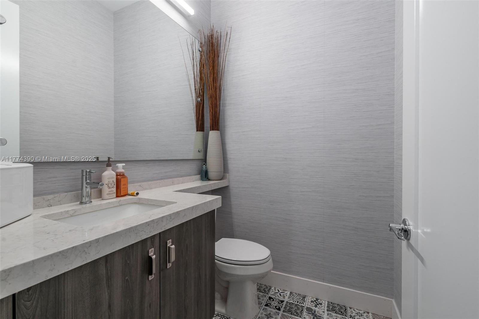 8577 Shoreacres Street Boca Raton, FL 33434 - Photo 30 of 67 a bathroom with a sink and a toilet