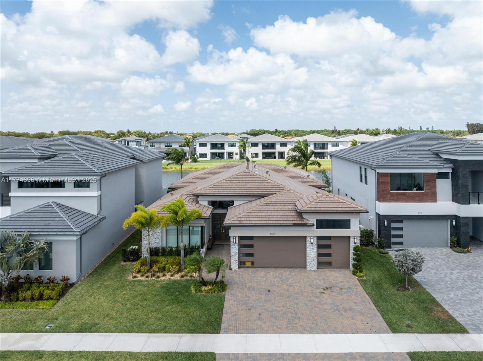 8577 Shoreacres Street Boca Raton, FL 33434 - Photo 3 of 67 an aerial view of a house with a yard