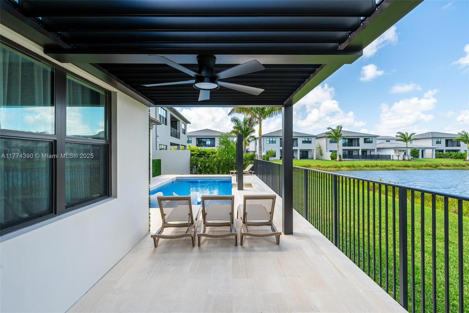 8577 Shoreacres Street Boca Raton, FL 33434 - Photo 51 of 67 a view of a porch with furniture and a yard