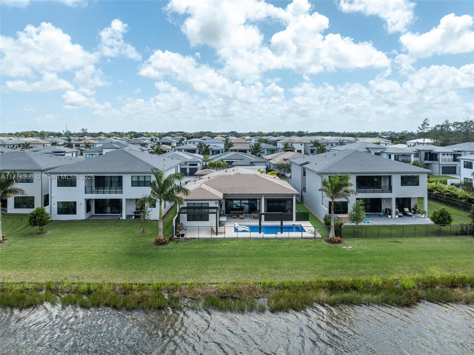 8577 Shoreacres Street Boca Raton, FL 33434 - Photo 53 of 67 a view of a house with a yard deck and sitting area
