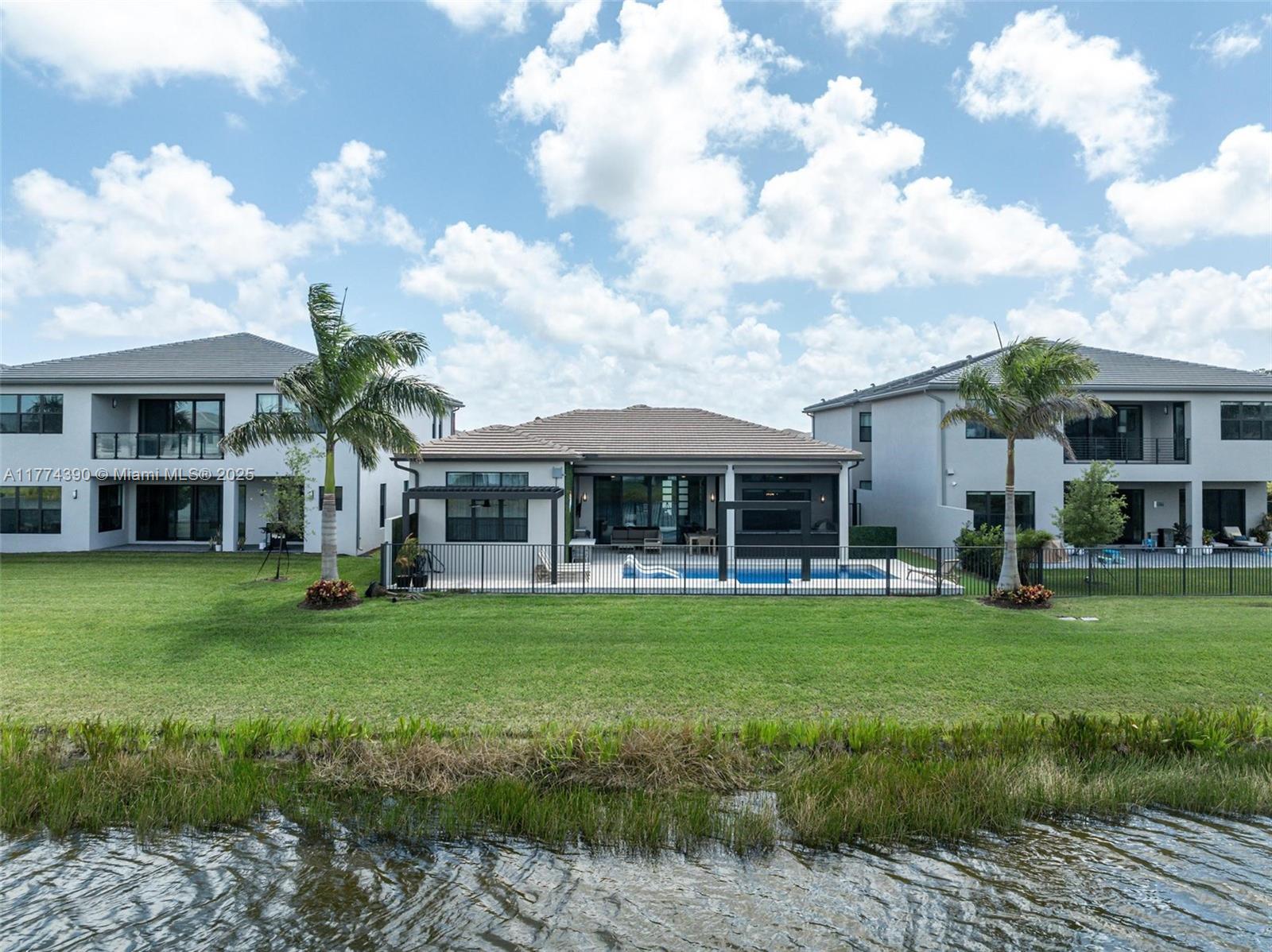 8577 Shoreacres Street Boca Raton, FL 33434 - Photo 54 of 67 a front view of a house with a garden