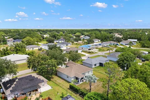 an aerial view of a house with a garden