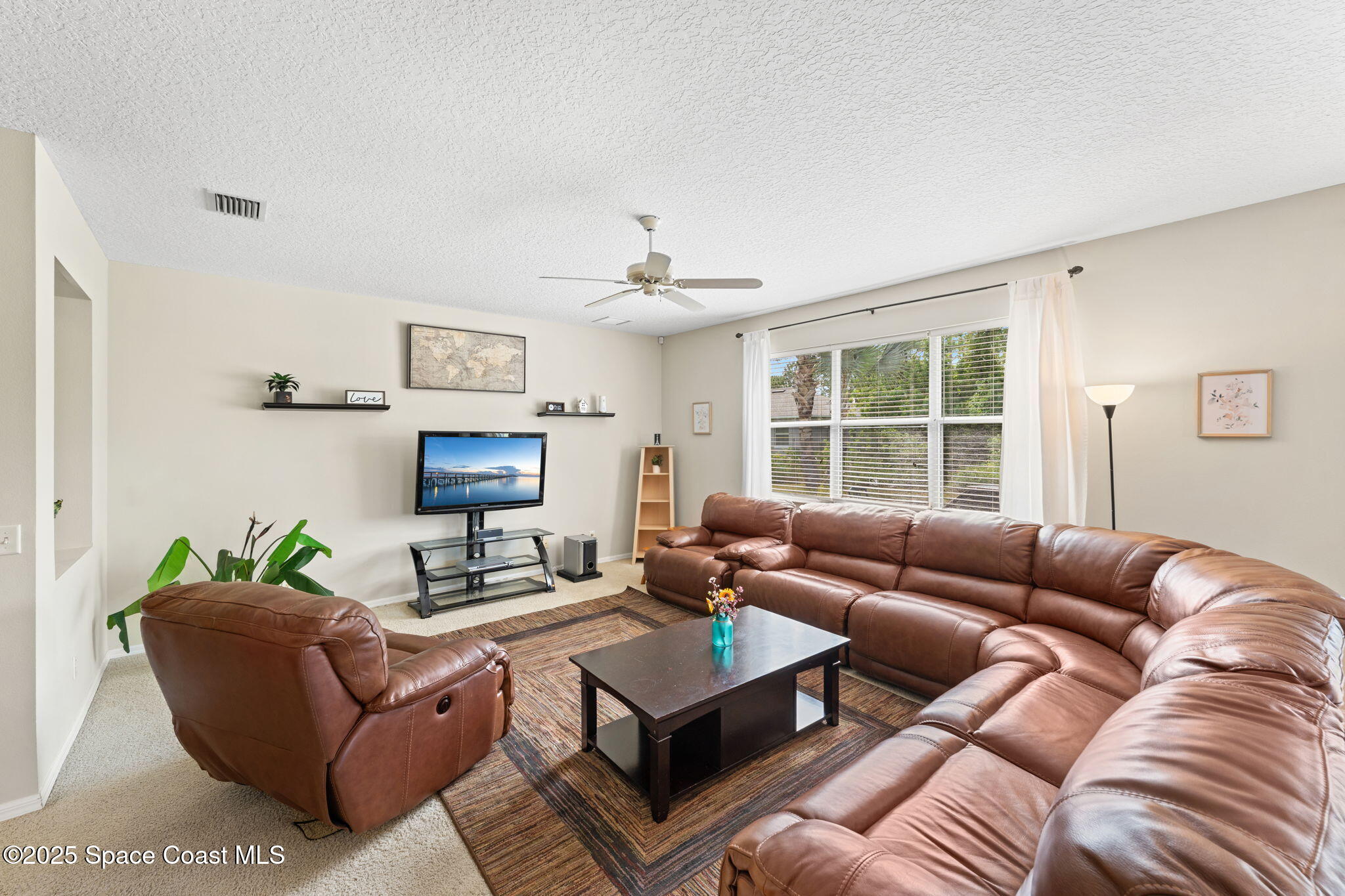 1266 Ragen Road Southeast Palm Bay, FL 32909 - Photo 5 of 28 a living room with furniture and a window