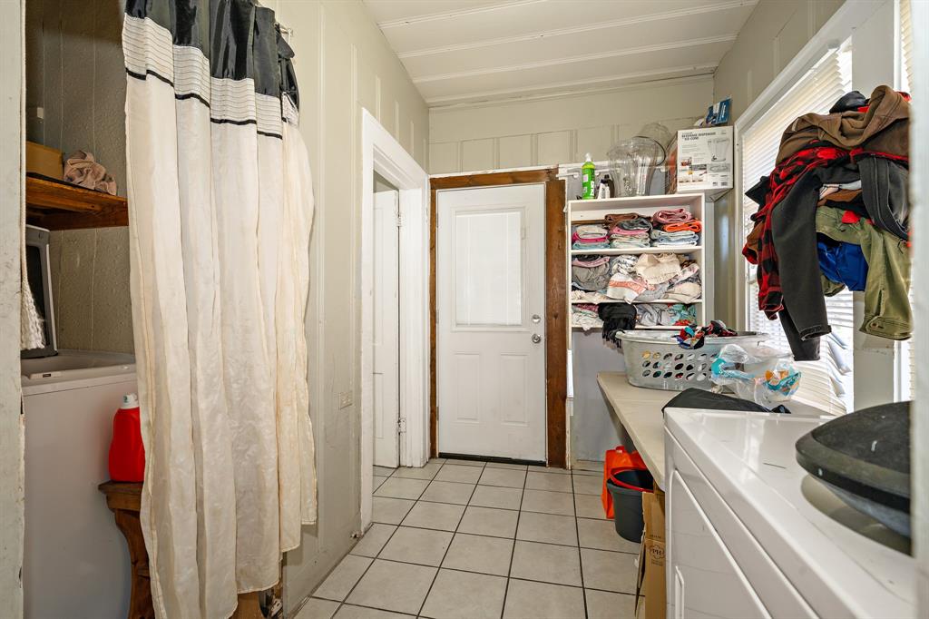 502 North 23rd Street Waco, TX 76707 - Photo 14 of 19 a view of walk in closet with clothes and shoes
