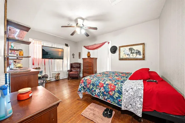 a bedroom with a bed and dresser