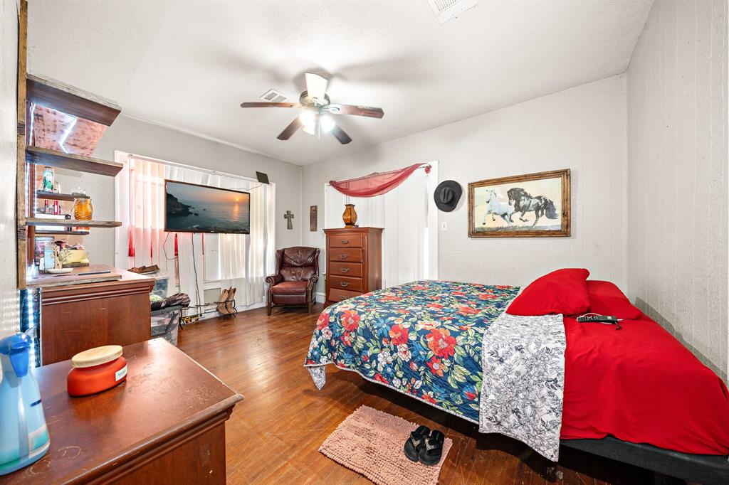 502 North 23rd Street Waco, TX 76707 - Photo 9 of 19 a bedroom with a bed and dresser