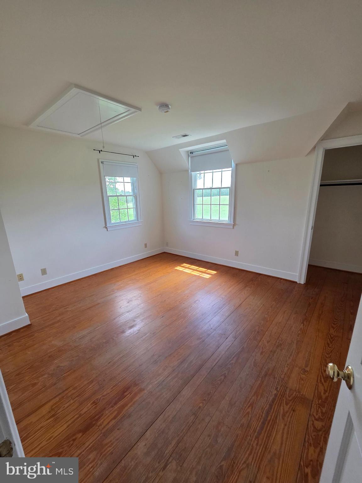 2565 Crenshaw Road Marshall, VA 20115 - Photo 7 of 14 an empty room with wooden floor and windows