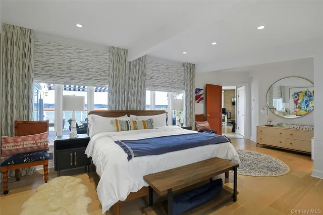 a spacious bedroom with a bed and a couch