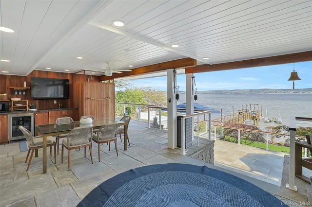 a view of a patio with wooden floor