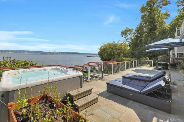 a living room with lots of furniture and view of kitchen