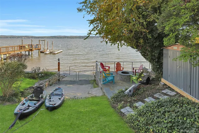 an aerial view of a house with a lake view
