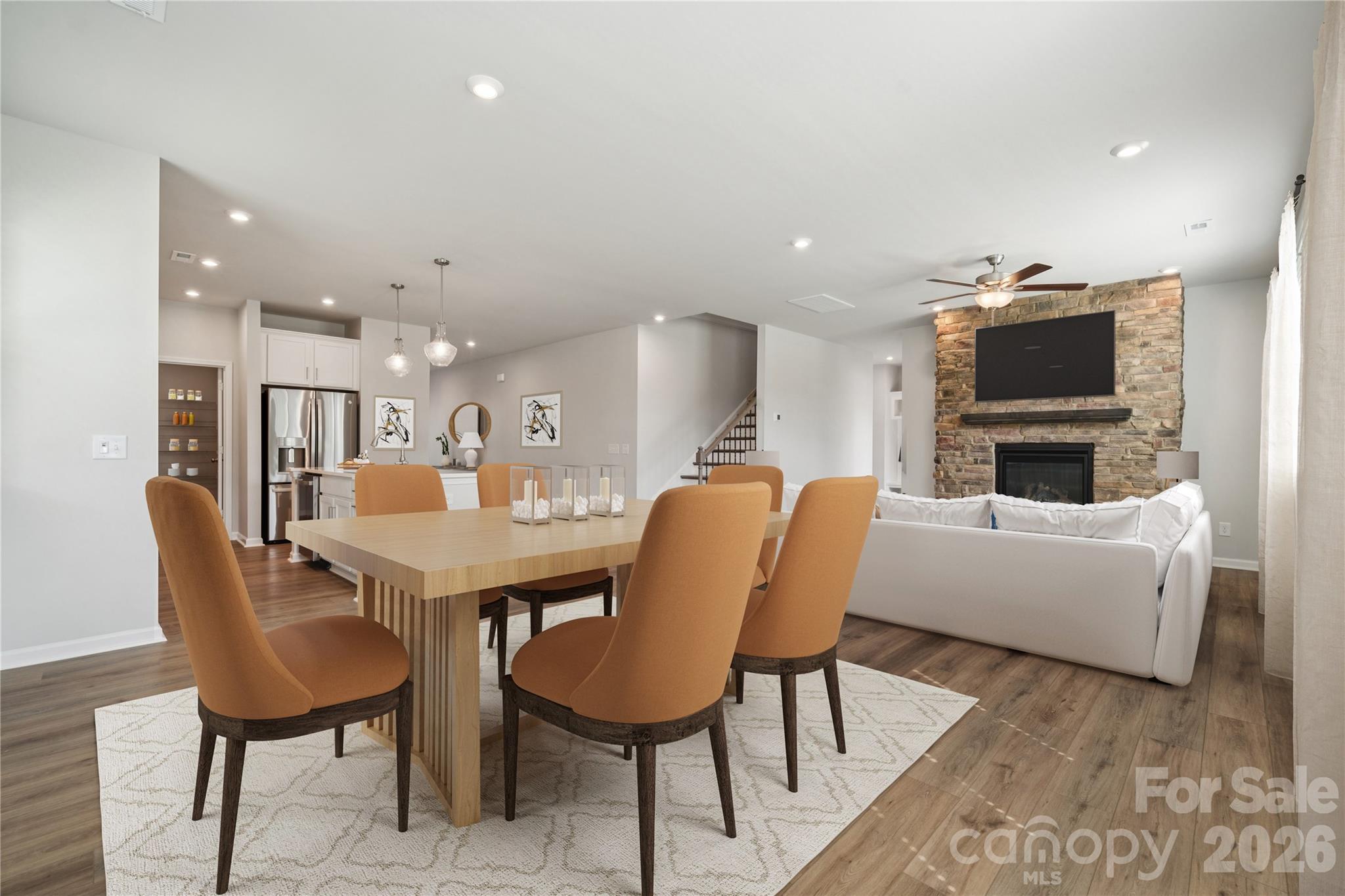 415 Alameda Way Matthews, NC 28104 - Photo 19 of 33 a living room with furniture a flat screen tv and kitchen view