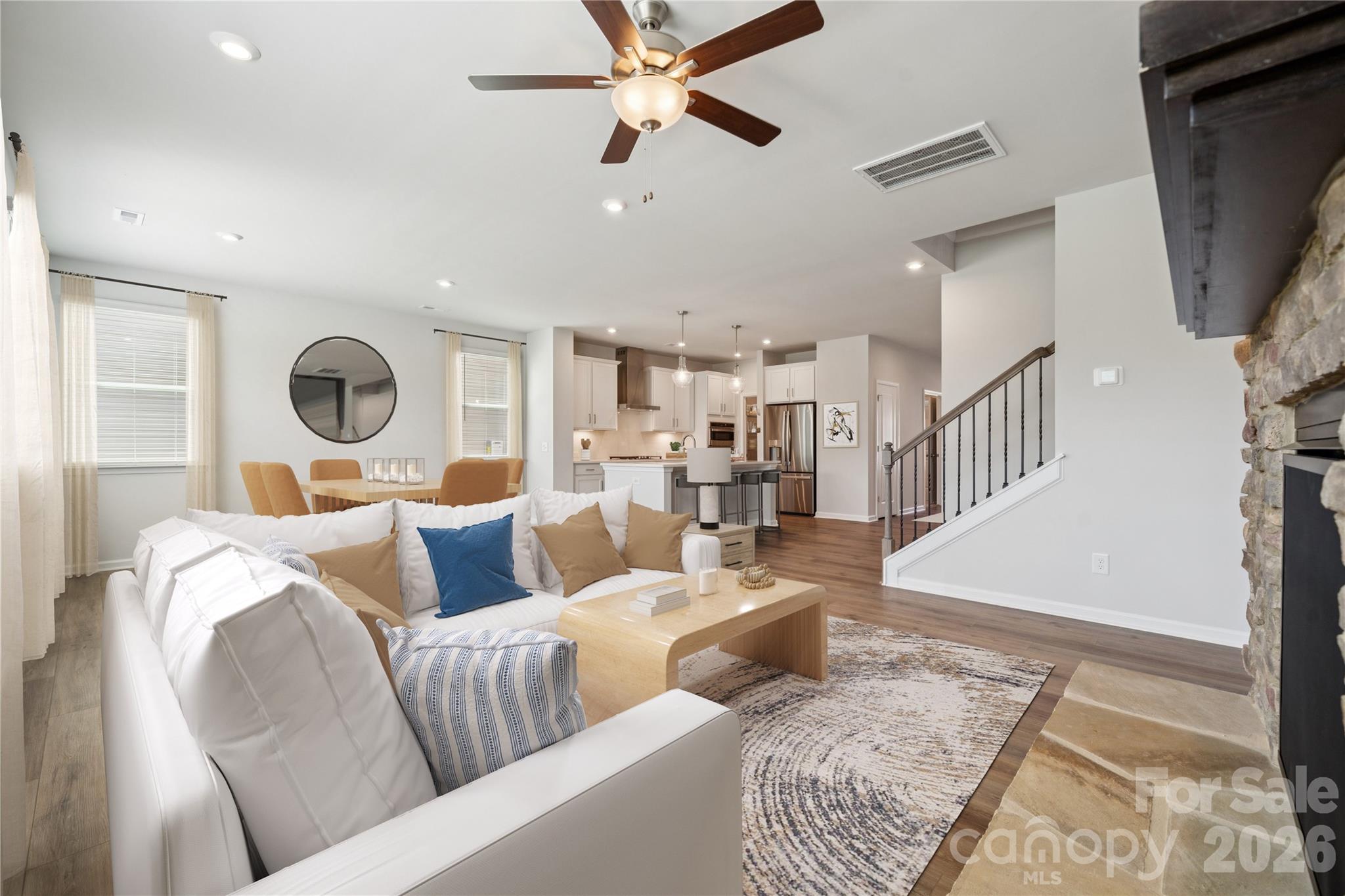 415 Alameda Way Matthews, NC 28104 - Photo 23 of 33 a living room with furniture and a chandelier