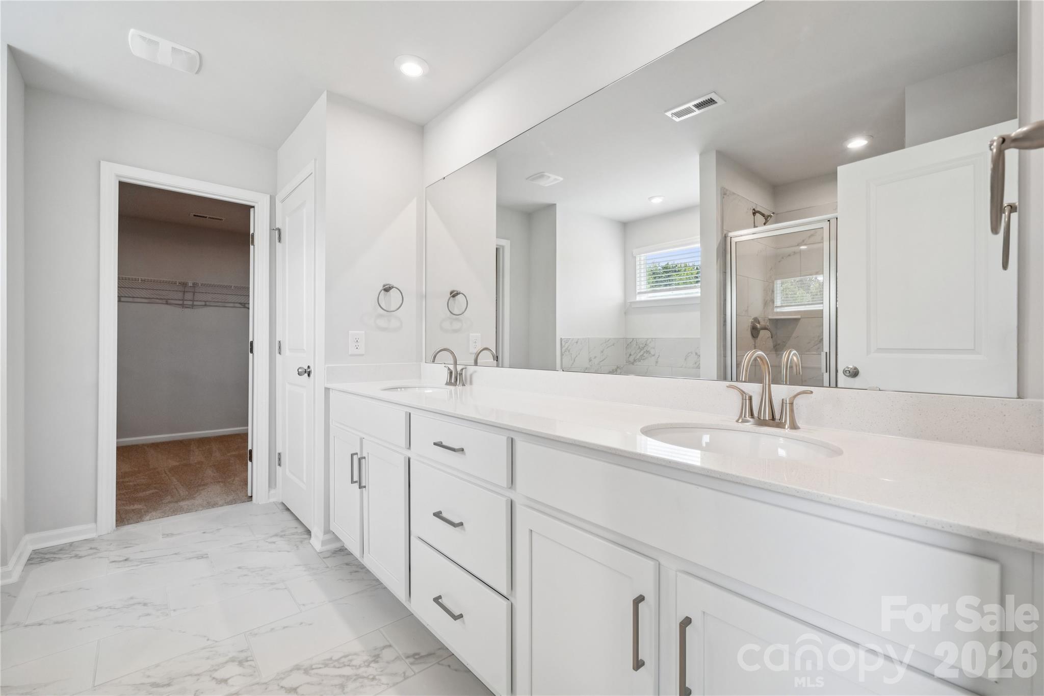 415 Alameda Way Matthews, NC 28104 - Photo 4 of 33 a spacious bathroom with double sink and a large mirror