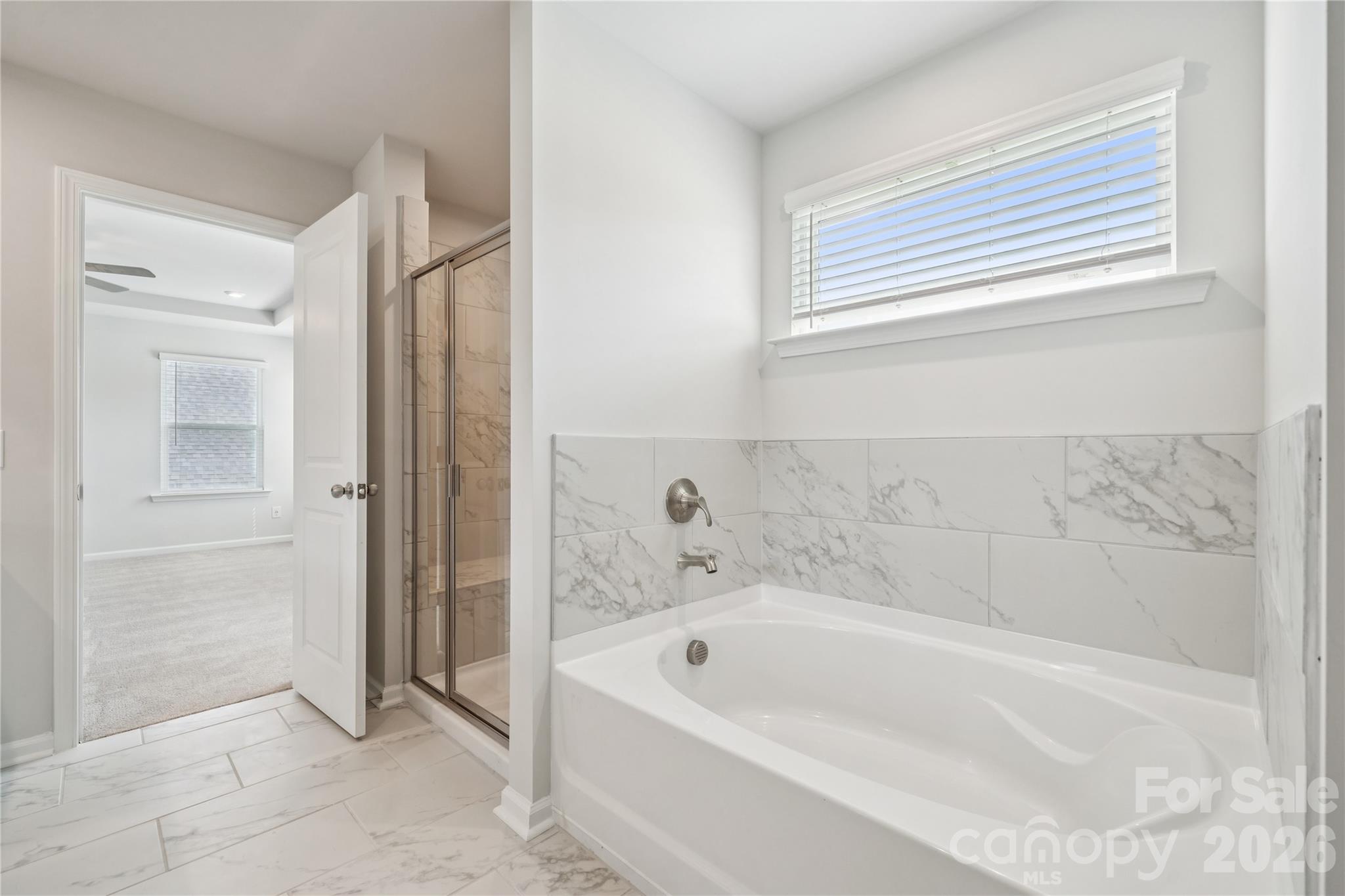 415 Alameda Way Matthews, NC 28104 - Photo 5 of 33 a bathroom with a bathtub and a shower