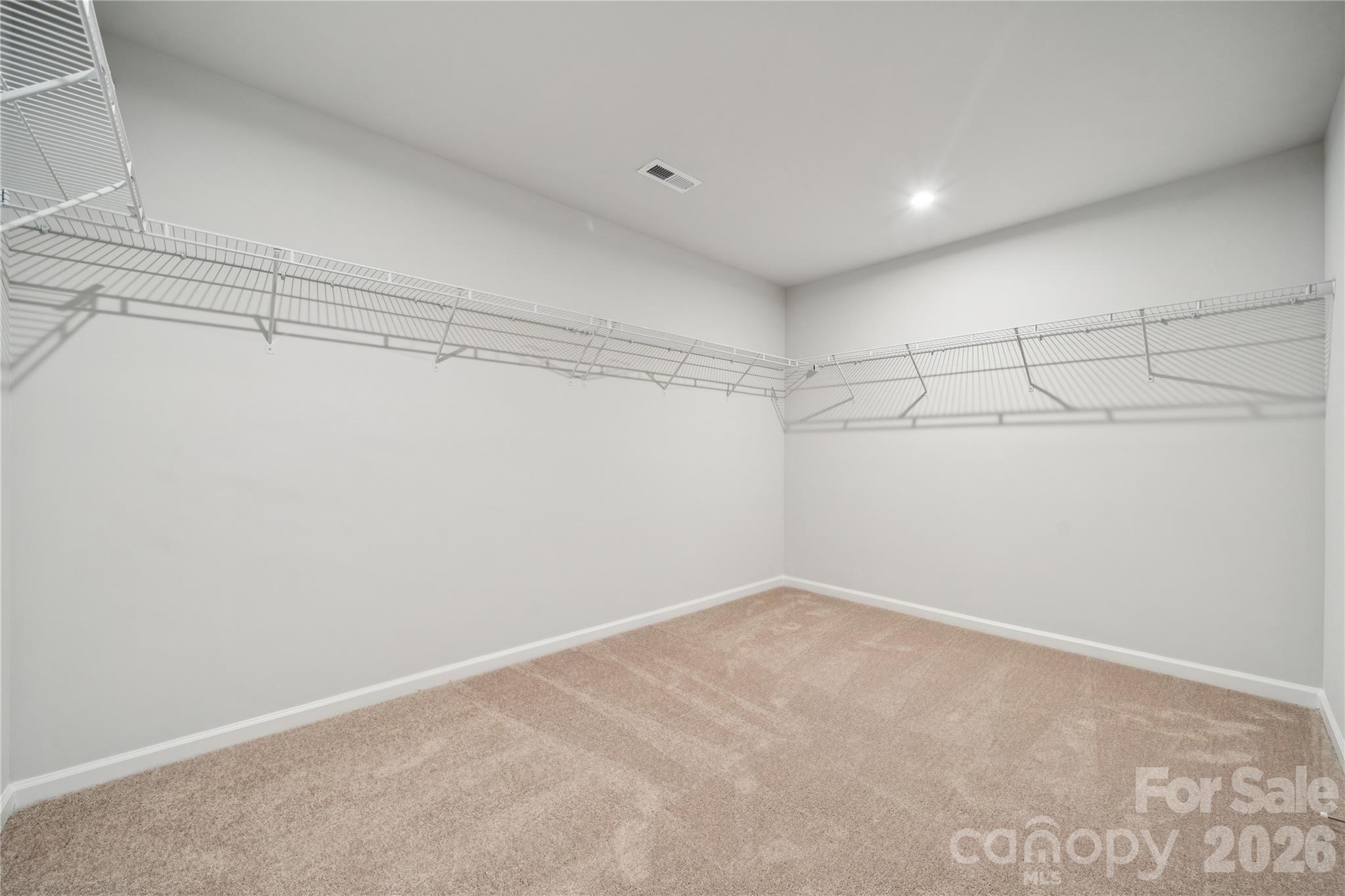 415 Alameda Way Matthews, NC 28104 - Photo 6 of 33 a view of a room with racks on the wall
