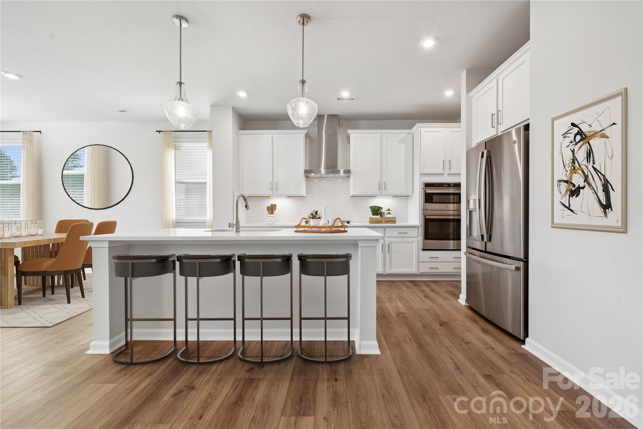 415 Alameda Way Matthews, NC 28104 - Photo 7 of 33 a kitchen with granite countertop a stove a sink dishwasher a refrigerator with wooden floor