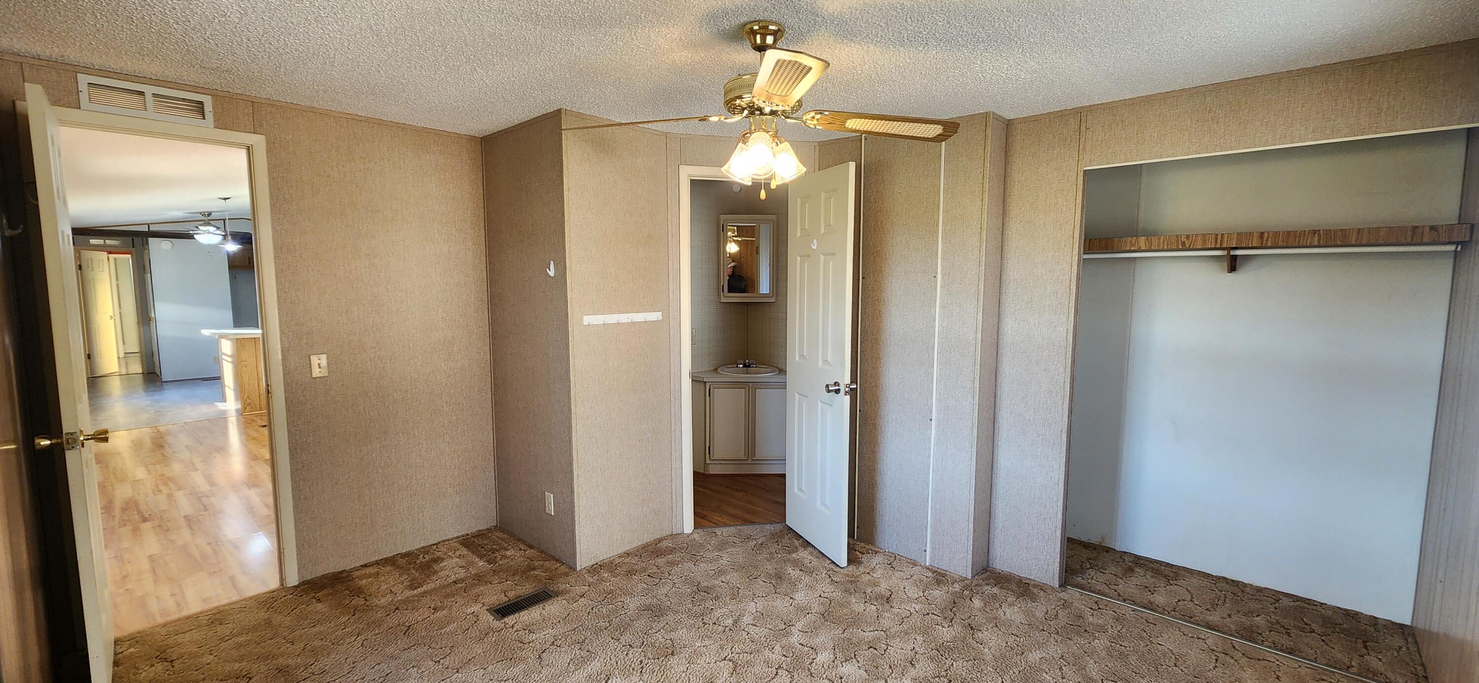 621 Kent Road Wirtz, VA 24184 - Photo 11 of 18 a view of a bathroom with a shower and a mirror