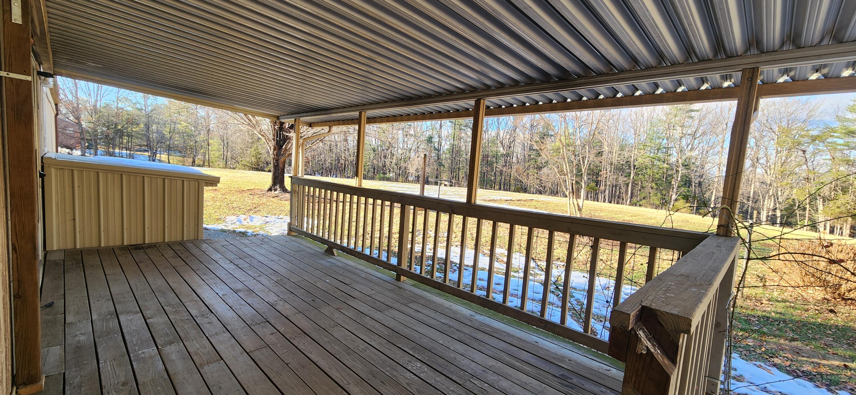 621 Kent Road Wirtz, VA 24184 - Photo 12 of 18 a view of a porch with wooden floor