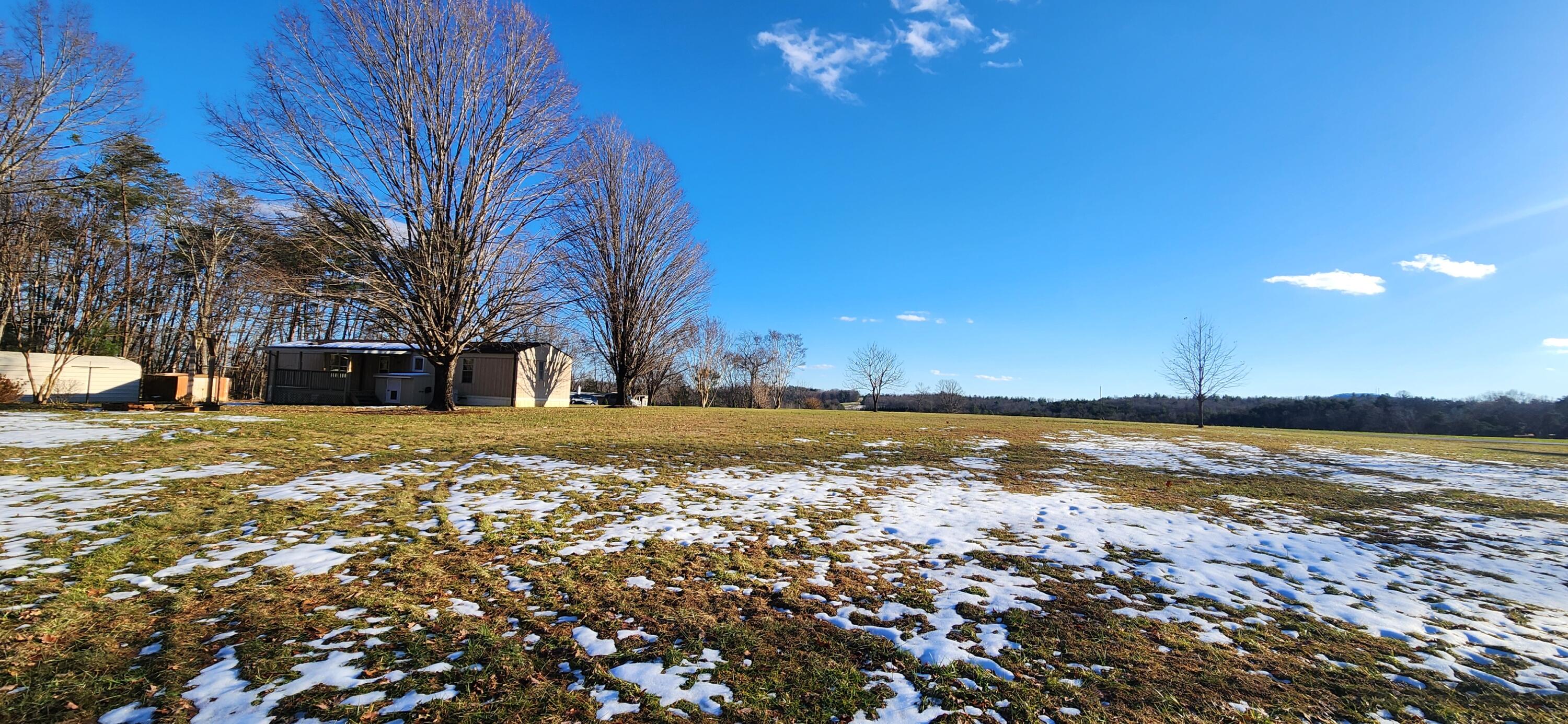 621 Kent Road Wirtz, VA 24184 - Photo 15 of 18 a view of a lake with a building in the background