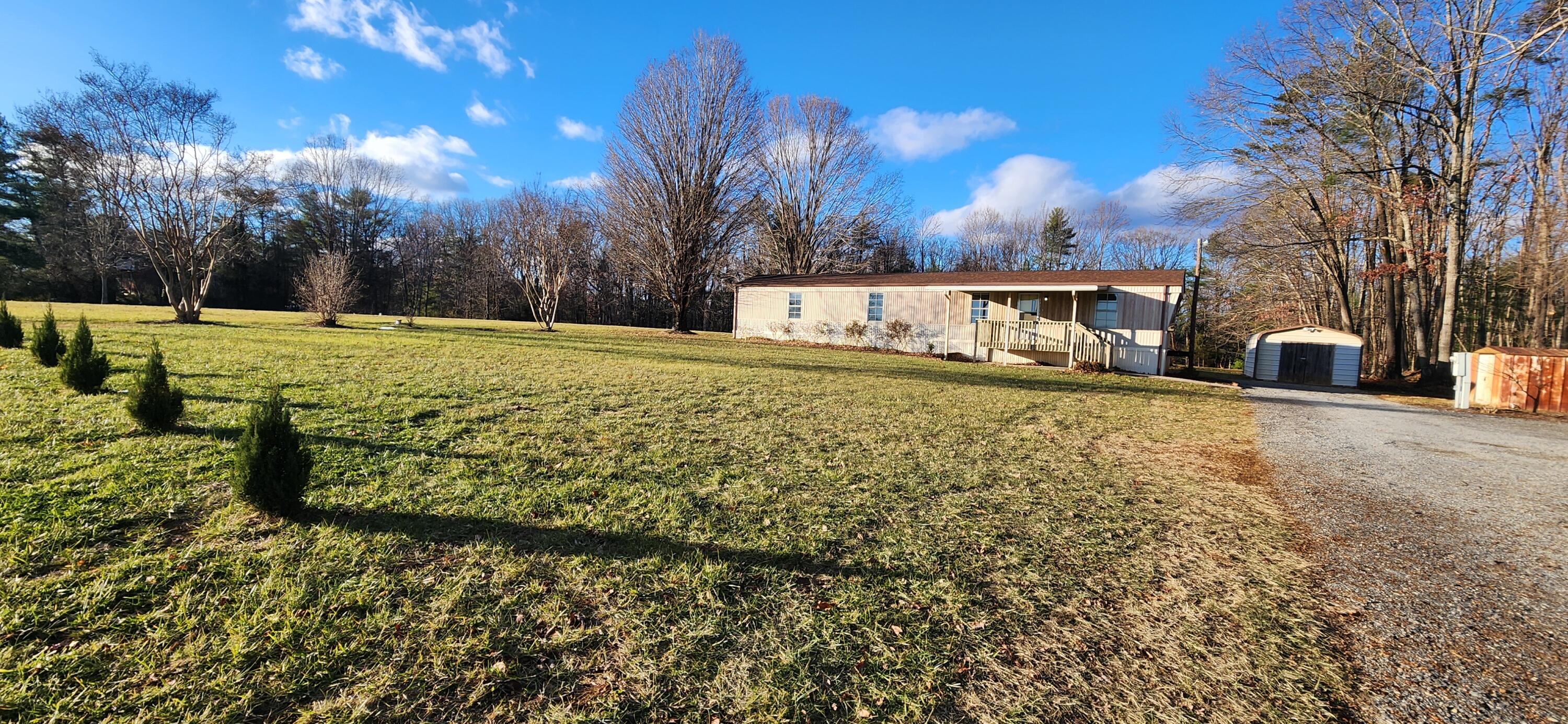 621 Kent Road Wirtz, VA 24184 - Photo 17 of 18 a view of a house with a yard
