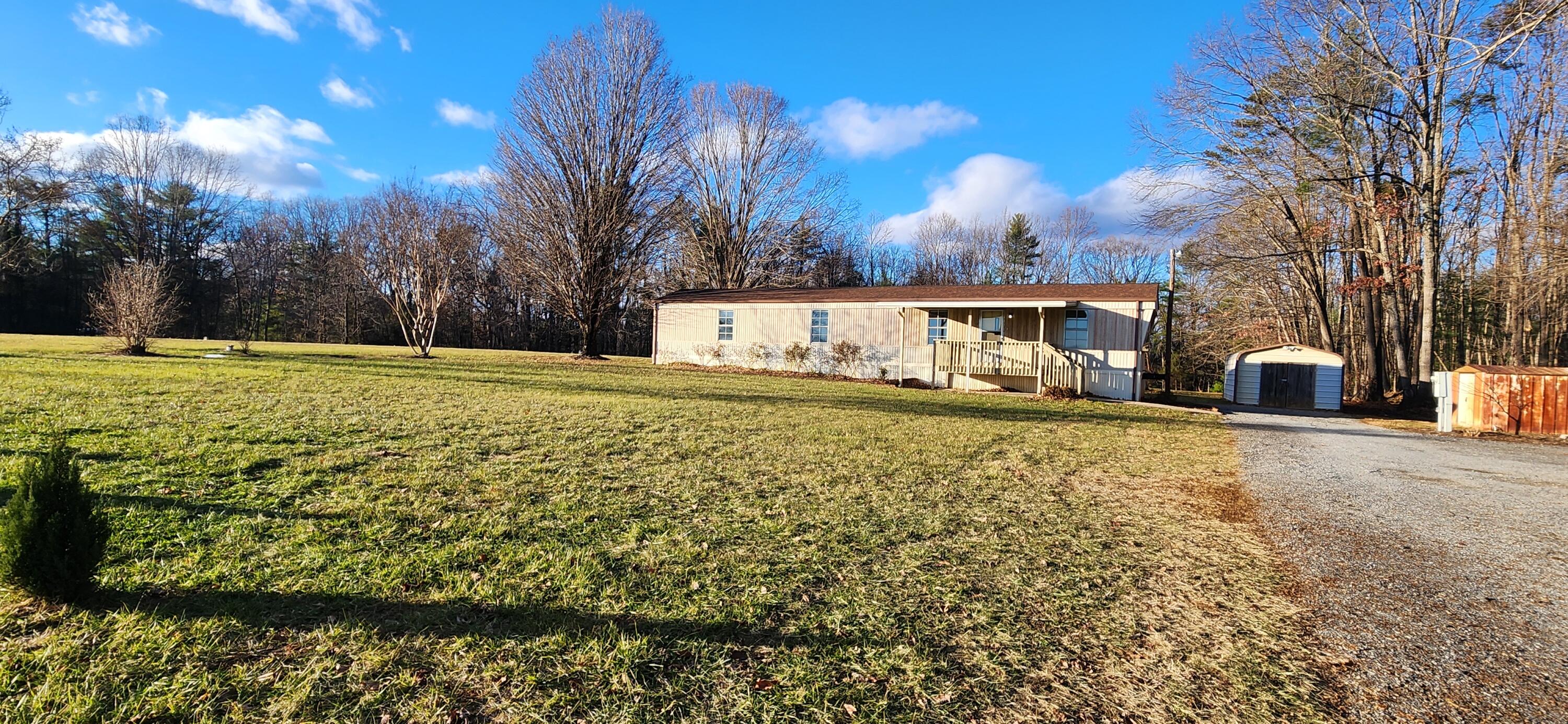 621 Kent Road Wirtz, VA 24184 - Photo 18 of 18 a view of an house with backyard and trees