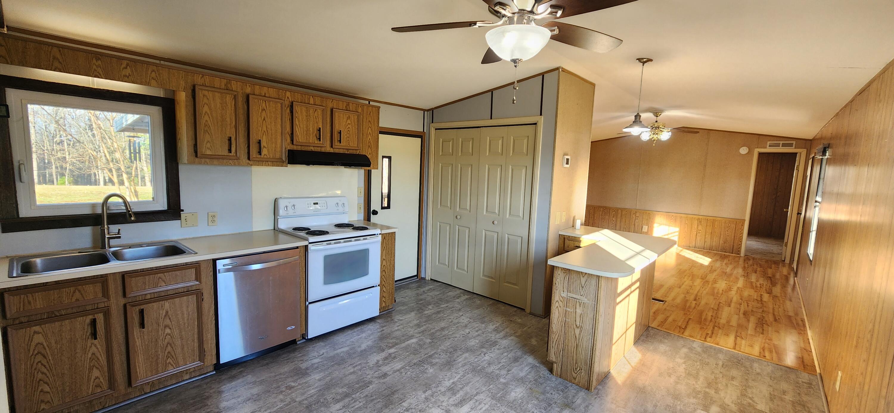621 Kent Road Wirtz, VA 24184 - Photo 2 of 18 a kitchen with a sink appliances and cabinets