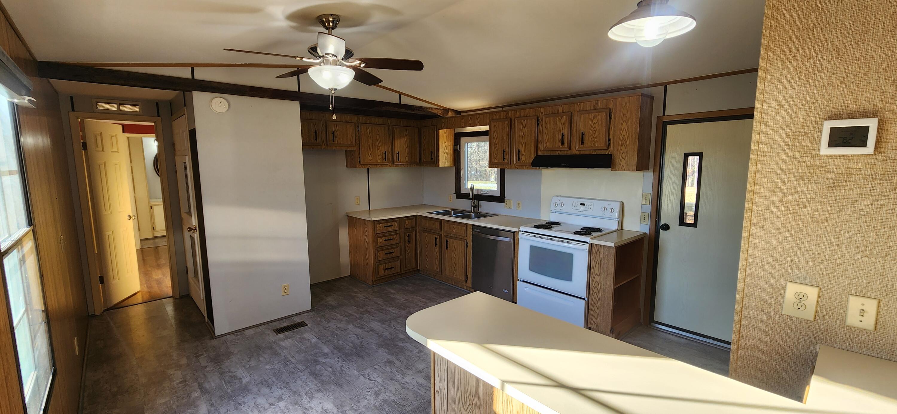 621 Kent Road Wirtz, VA 24184 - Photo 3 of 18 a kitchen with stainless steel appliances granite countertop a refrigerator a stove a sink and a refrigerator